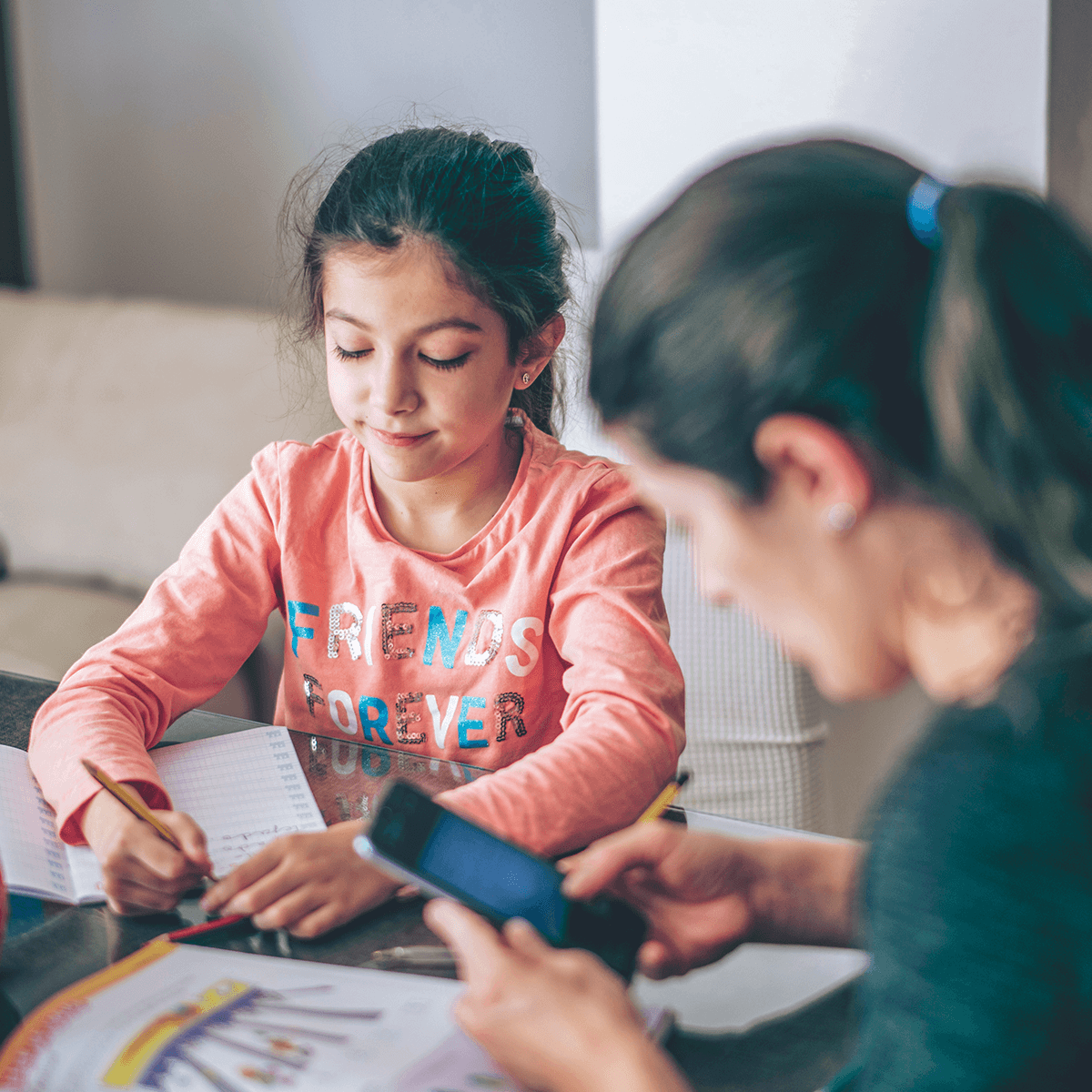 Mother and Daughter doing homework together